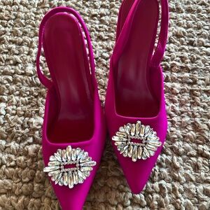Pink heels with rhinestone embellishment